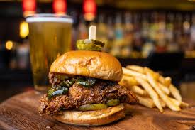 Bar Louie signature dishes Hot Honey Chicken SandwichSalmon SlidersBeef Sliders